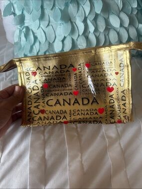 Gold Canada Print Wristlet Pouch with Red Heart Accents